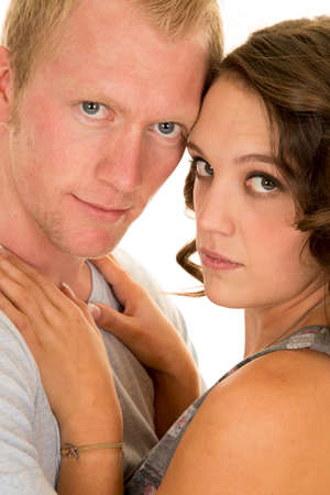 a couple with their heads together getting close.の写真素材