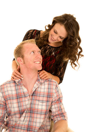 A couple looking at each other with big smiles.の写真素材