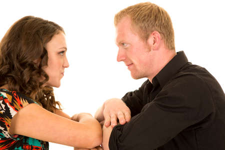 a couple with their arms together looking into each others eyes.の写真素材