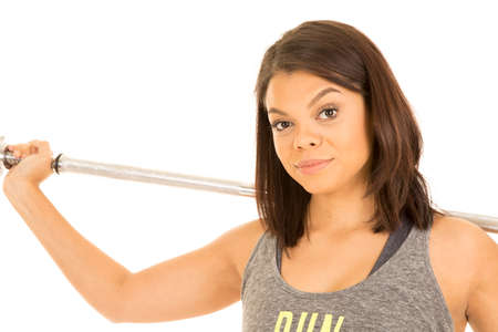 A woman with a serious expression with a bar on her shoulders.の写真素材