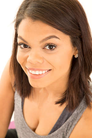 a woman in her fitness tank close up with a smile.の写真素材
