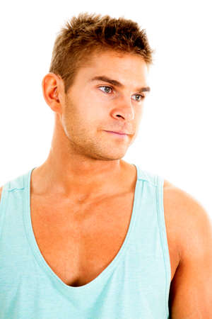 A man in his green tank looking to the side with a sad expression.の写真素材