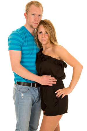 A man holding on to his woman looking.の写真素材
