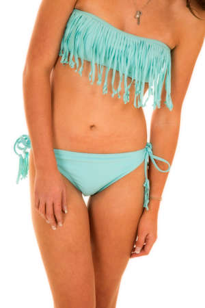 A woman in her bikini with blue fringe and a necklace.の写真素材