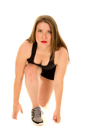 a woman with a serious expression on  her face in her running poseの写真素材