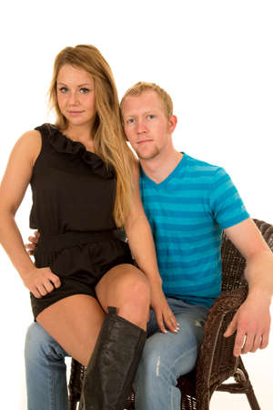 a woman sitting on her man's lap holding each other.の写真素材