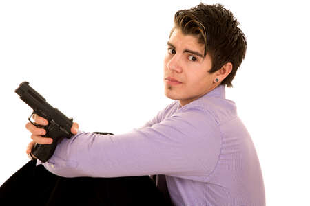 A man in his purple business shirt holding on to his weapon.の写真素材