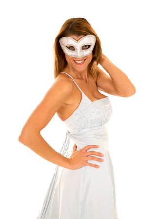 a woman in her mysterious mask with a smile on her face.の写真素材