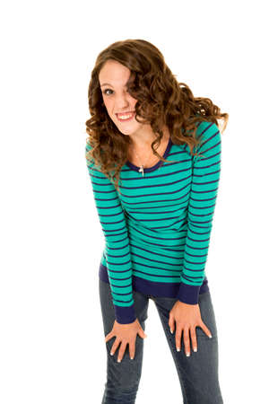A woman leaning forward with a funny expression on her face.の写真素材