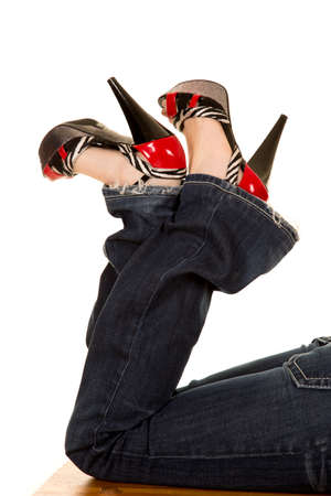 A close up of a woman in jeans with heels.の写真素材
