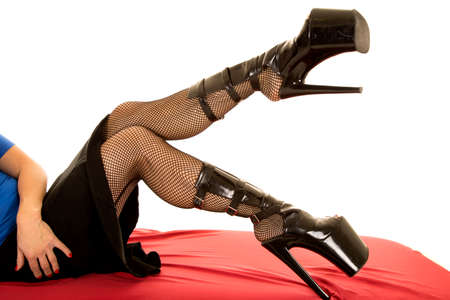 A woman with her shoes up in the air.の写真素材