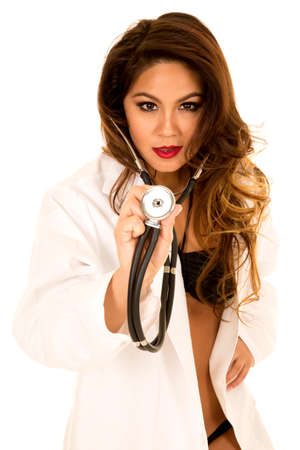 a woman in her lab coat and bikini with a stethoscope.の写真素材