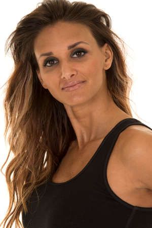 a woman in her black tank with a smile on her face,の写真素材
