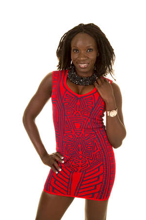 An African American beautiful woman in her red fitted dress with a smile.の写真素材