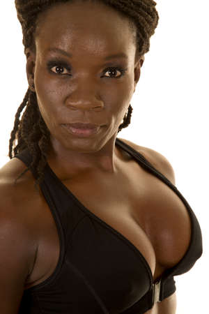 A close up of a woman in her bikini top with a serious expression,の写真素材