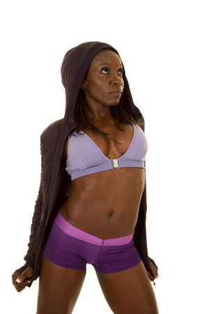 An African American woman holding on to her jacket in her fitness clothing.の写真素材