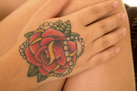 A tattoo on a woman's hand up close.の写真素材