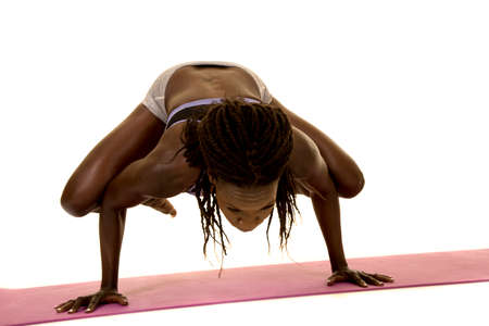 An African American woman showing her strength and balance.の写真素材