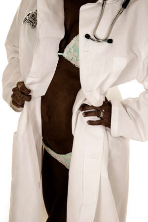 a fit woman in her bikini and doctors jacket with a stethoscope.の写真素材