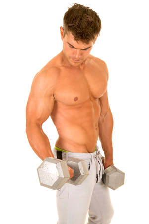 A man without his shirt on working out with weights.の写真素材