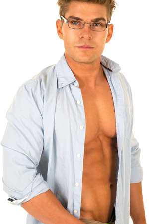 A man in his dress shirt open looking with his glasses on.の写真素材