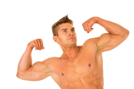 a man working on flexing his muscles showing off his chest.の写真素材