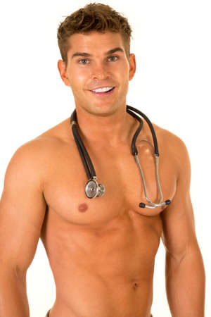 a Doctor with a muscular body with his stethoscope around his neck, and a smile.の写真素材