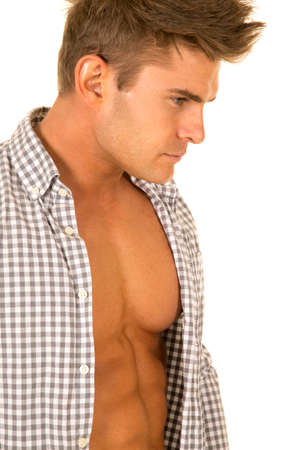 a man with his shirt opened showing off his chest.の写真素材