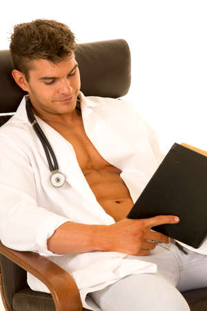 A Doctor taking a break and relaxing with a book.の写真素材