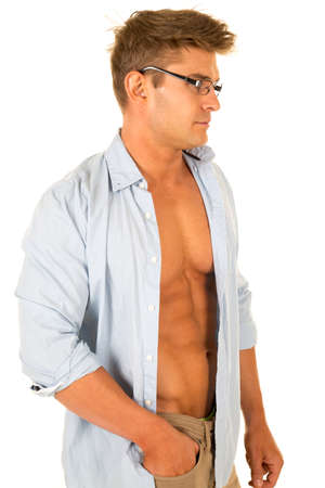 A man in his dress shirt open showing off his muscular chest.の写真素材