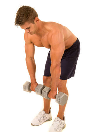A man doing a deadlift with weights, working out his legs.の写真素材