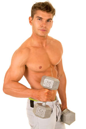 a man without his shirt on working on his muscles.の写真素材