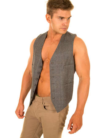 A man in his vest with out a shirt, showing off his muscular chest.の写真素材