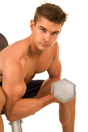 a man doing an arm curl flexing his muscles.の写真素材