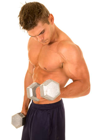 A man without a shirt on doing an arm curl wtih weights.の写真素材