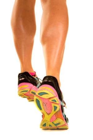 A woman's calves flexed and walking awayの写真素材