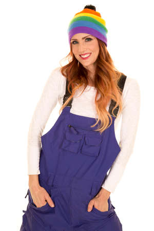 A woman in her purple coveralls with a smile, wearing her colorful beanie.の写真素材
