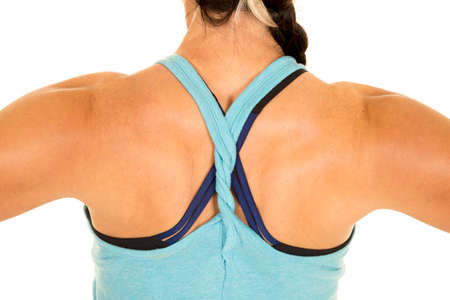 A woman in her fitness clothing showing off her back muscles.の写真素材