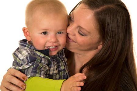 A mother holding on to her little boy.の写真素材