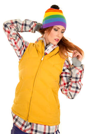 A woman in her ski vest and winter colorful beanie.の写真素材