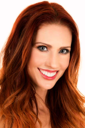 a woman with a big smile and beautiful red hair.の写真素材