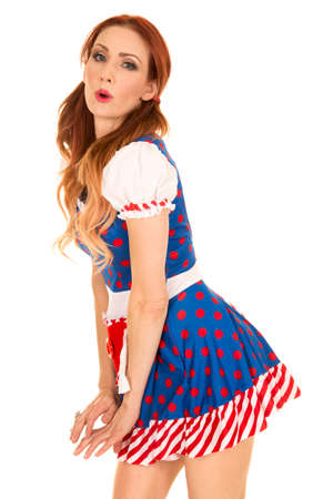 a woman being playful in her costume, leaning over.の写真素材