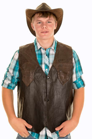 A young cowboy with a western vest on looking forward.の写真素材