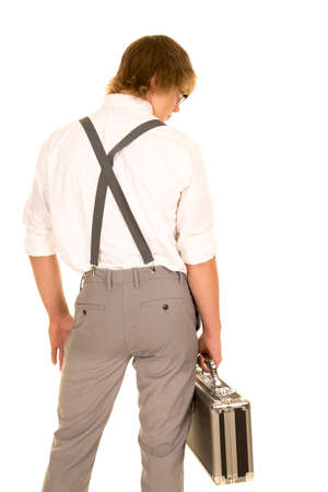 a young man in his business slacks holding on to his case.の写真素材