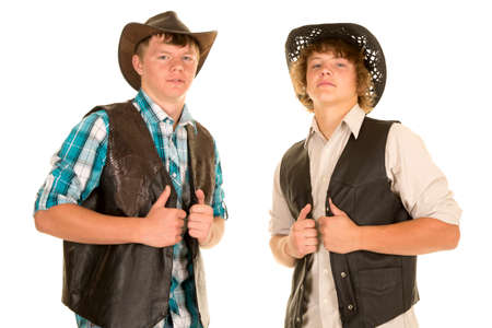 Two teen cowboys in their western hats showing some attitude.の写真素材