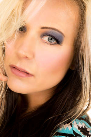 A close up of a woman's face with a sad expression on her face.の写真素材