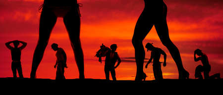 a silhouette of cowboys and women's legs.の写真素材