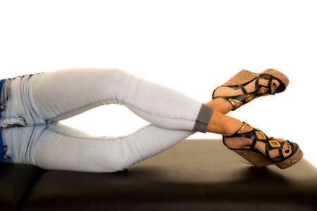 a woman laying on her side with her ankles crossed.