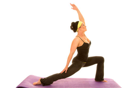 a woman reaching up doing her yoga stretch.の写真素材