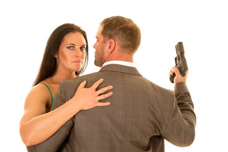 A couple together he has his pistol up.の写真素材
